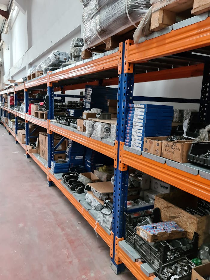 Long rows of industrial shelves stacked with various products in a Gaziantep warehouse.